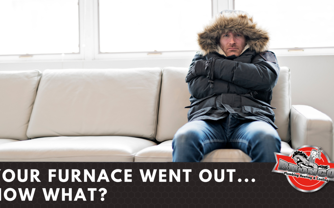 man sitting on sofa with winter jacket